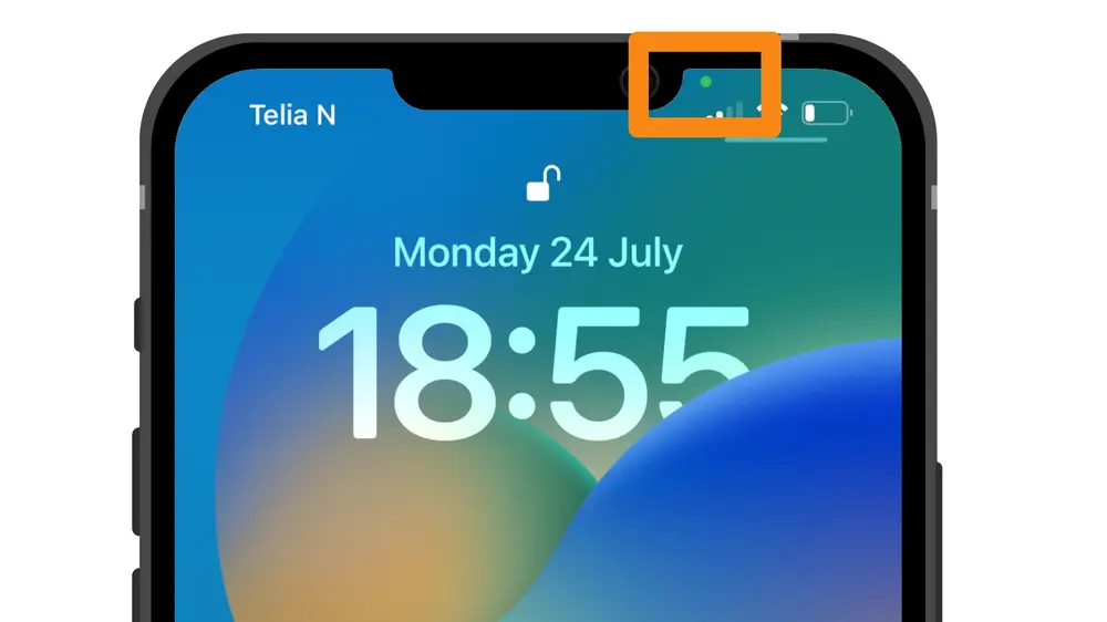 A green dot appearing on the iPhone lock screen