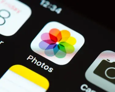 A picture of the icon of the Photos application on an iPhone